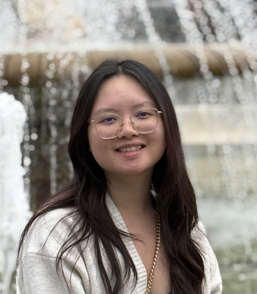 Portrait of Maggie Ma in front of a fountain